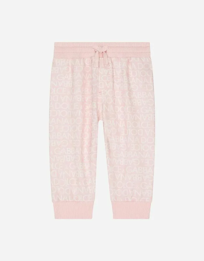 Dolce and Gabbana Trousers And Shorts Children Jersey Jogging Pants With Allover Logo Print Pink Dolce and Gabbana Trousers And Shorts Children Jersey Jogging Pants With Allover Logo Print Pink