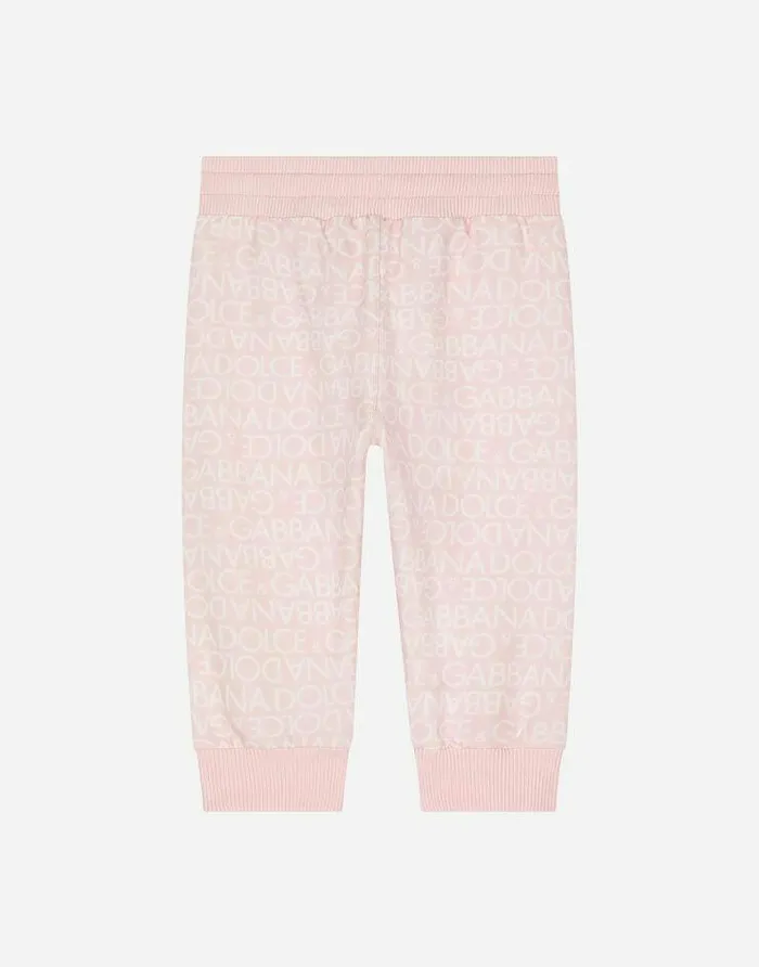 Dolce and Gabbana Trousers And Shorts Children Jersey Jogging Pants With Allover Logo Print Pink Dolce and Gabbana Trousers And Shorts Children Jersey Jogging Pants With Allover Logo Print Pink